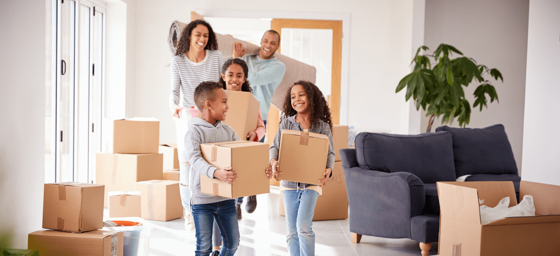 Happy family moving in to their new home thanks to First Secure Financial, LLC